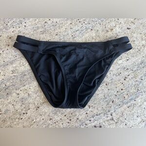 Black bikini swim bottoms cut out strappy sides hips
